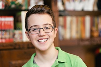Boy with braces smiling